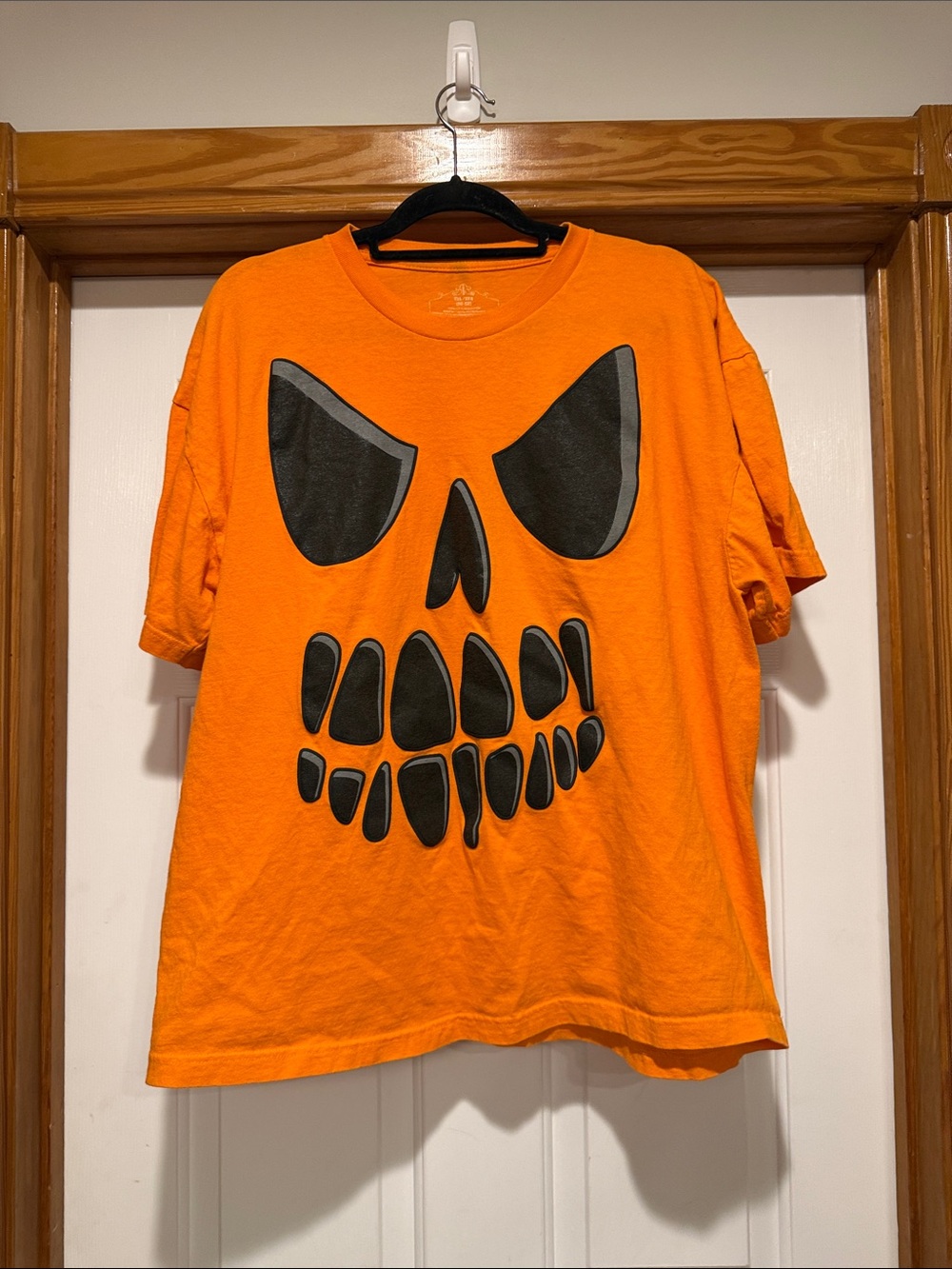 Men's Orange Short-Sleeve Graphic Tee with Black Skull Design